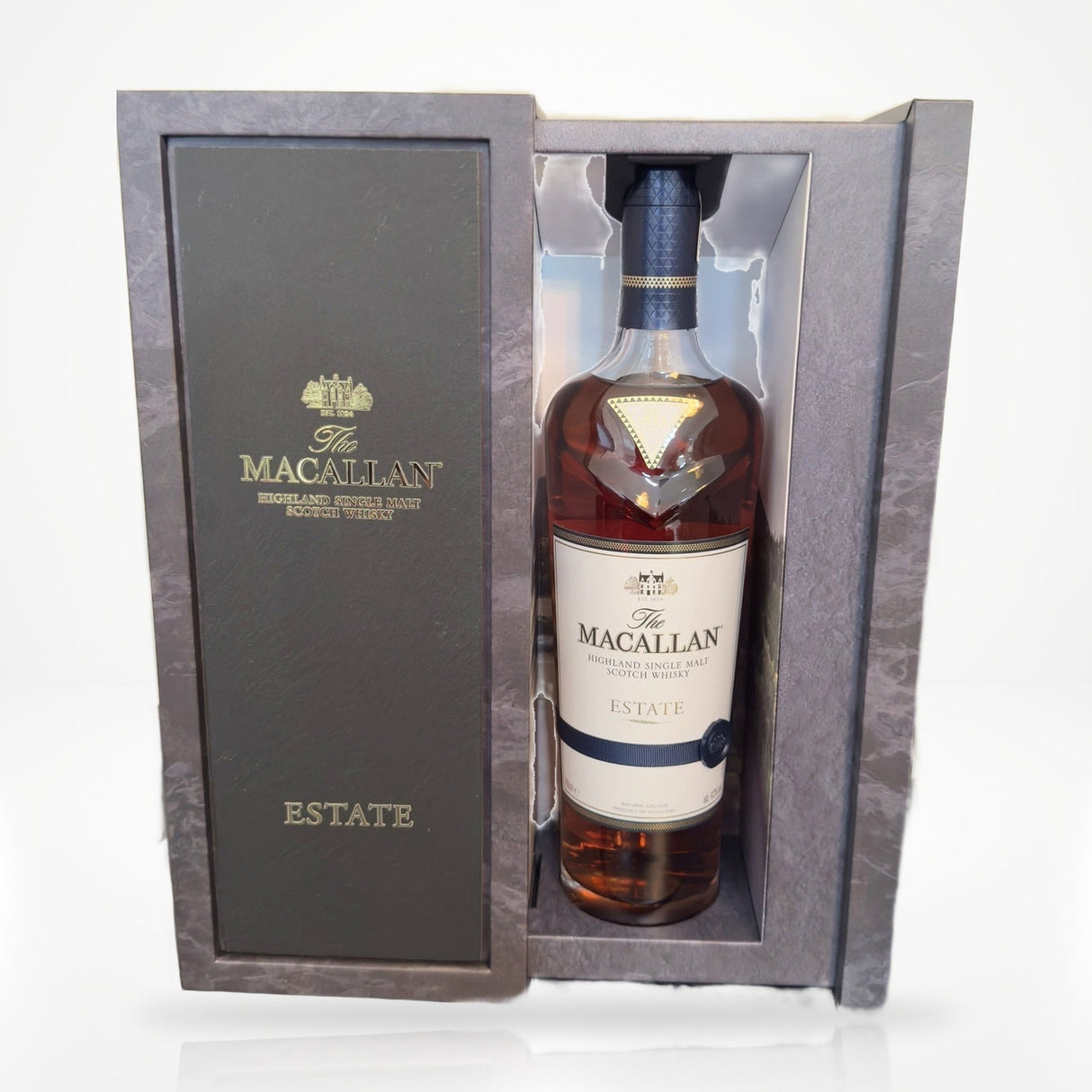 The Macallan Estate single malt Scotch whisky 750ml with presentation gift box on white studio background