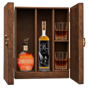 Blanton's Gold Edition & Eagle Rare 12 Year in a wooden gift box with two crystal glasses on white
