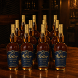 W.L. Weller Full Proof 114-proof wheated Kentucky straight bourbon — 12-bottle case, navy-and-gold labels, dark private-vault setting
