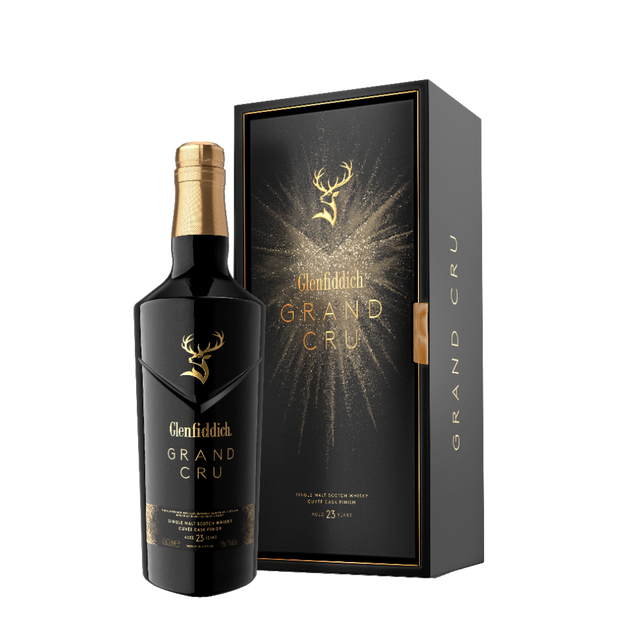 Glenfiddich Grand Cru 23 Year Old bottle with black and gold presentation box on black background