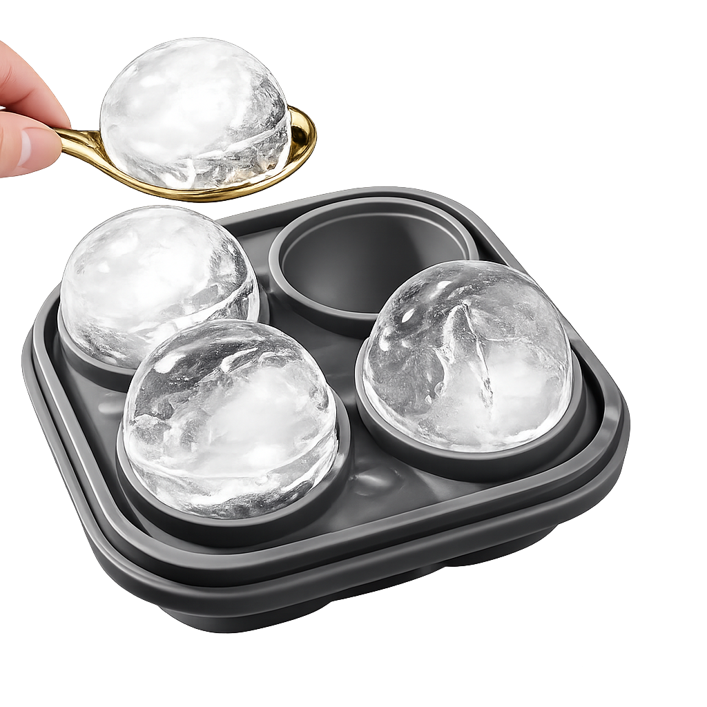 Whiskey ice mold tray with large ice spheres and spoon on white background