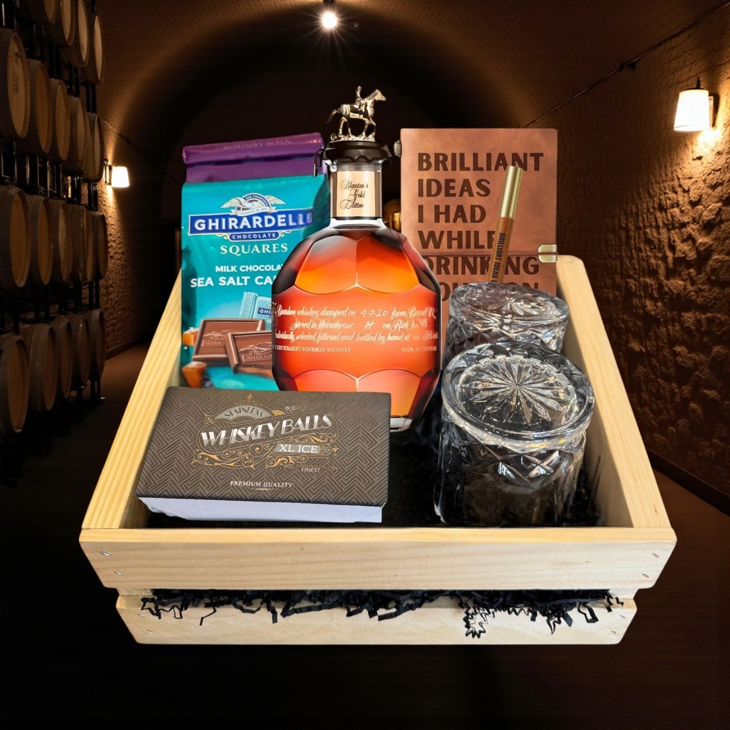 Engravable Blanton’s Gold Edition Single Barrel Bourbon Gift Crate displayed in a handcrafted wooden crate with glasses, chocolate, and journal – elegant bourbon presentation from Top Bourbon