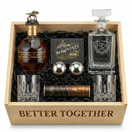 Blanton's Gold U.S. Release Bourbon Date Night "Better Together" Gift Crate featuring engraved decanter, two crystal-cut old-fashioned glasses, stainless-steel whiskey balls with freezer tray, and Turin liquor-filled chocolates in an engraved wooden crate
