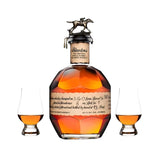 Blanton's Single Barrel Bourbon 750ml with iconic horse and jockey stopper, handwritten label, and two Glencairn tasting glasses filled with amber bourbon