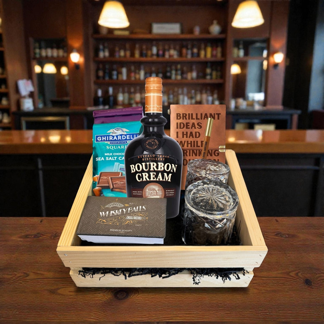 Buffalo Trace Bourbon Cream premium gift crate with glasses, chocolates, journal, and whiskey ball set in a bar setting – Top Bourbon exclusive gift