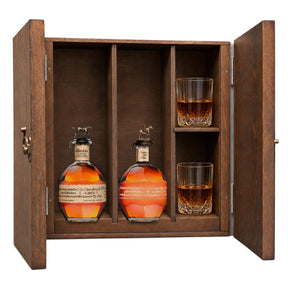 Blanton's Original Single Barrel & Blanton's Gold Edition in a wooden gift box with two crystal glasses on white