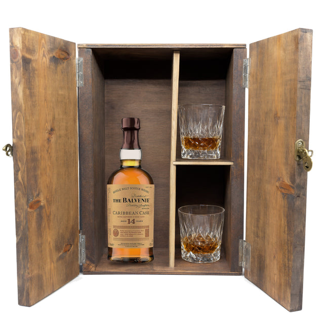 The Balvenie 14 Year Caribbean Cask in a wooden gift box with two crystal glasses on white