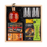 Blanton's Gold Edition bourbon gift crate with two crystal-cut glasses, whiskey stones, ground coffee, dark chocolate, and pistachios nested in a natural wood crate.