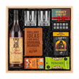 Old Rip Van Winkle 10 Year bourbon gift crate with two glasses, a leather bourbon journal and pen, whiskey stones, coffee, chocolate, and pistachios in a wood crate.