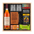 Pappy Van Winkle 12 Year Lot B bourbon gift crate with two glasses, a leather bourbon journal and pen, whiskey stones, coffee, chocolate, and pistachios in a wood crate.