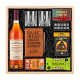 Pappy Van Winkle 12 Year Lot B bourbon gift crate with two glasses, a leather bourbon journal and pen, whiskey stones, coffee, chocolate, and pistachios in a wood crate.
