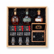 Blanton's Executive gift crate with three Blanton's bourbon editions, three Glencairn-style glasses, three whiskey stones sets, and a hand-finished wooden accessory box with a cutter and lighter, nested in a natural wood crate.