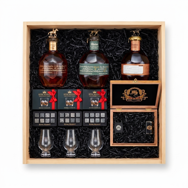 Blanton's Executive gift crate with three Blanton's bourbon editions, three Glencairn-style glasses, three whiskey stones sets, and a hand-finished wooden accessory box with a cutter and lighter, nested in a natural wood crate.