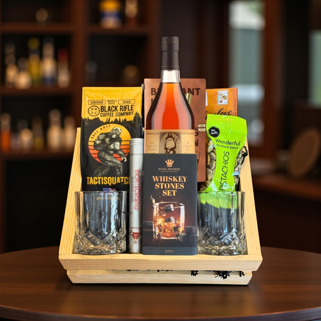 Engravable Old Rip Van Winkle 10 Year Top Shelf Gift Crate with bourbon, coffee, chocolate, pistachios, cigar, whiskey stones, journal, and glasses on wooden table – Top Bourbon lifestyle image