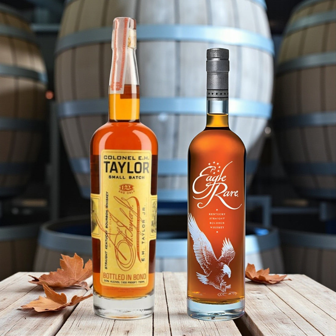 Engravable Eagle Rare and Colonel E.H. Taylor Small Batch Bourbon bottles on wooden table with bourbon barrels and autumn leaves – Top Bourbon lifestyle image