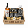 The Macallan 18 Year Double Cask gift crate with Ferrero Rocher 8-piece chocolates on white background